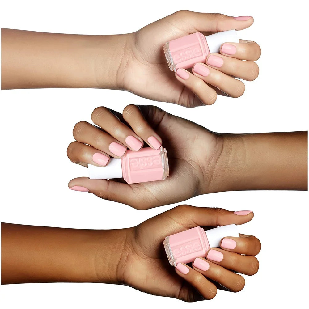 Three polished hands holding pink nail color